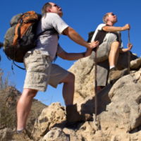 Two men about to climb a mountain